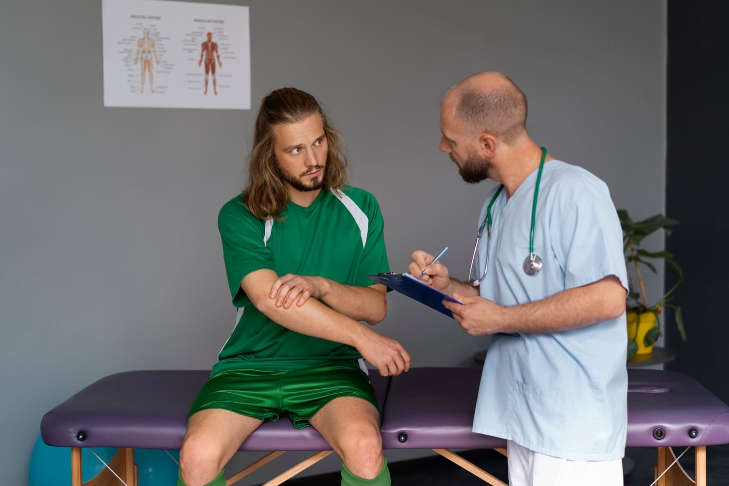 Physical therapist evaluating an athlete's elbow injury