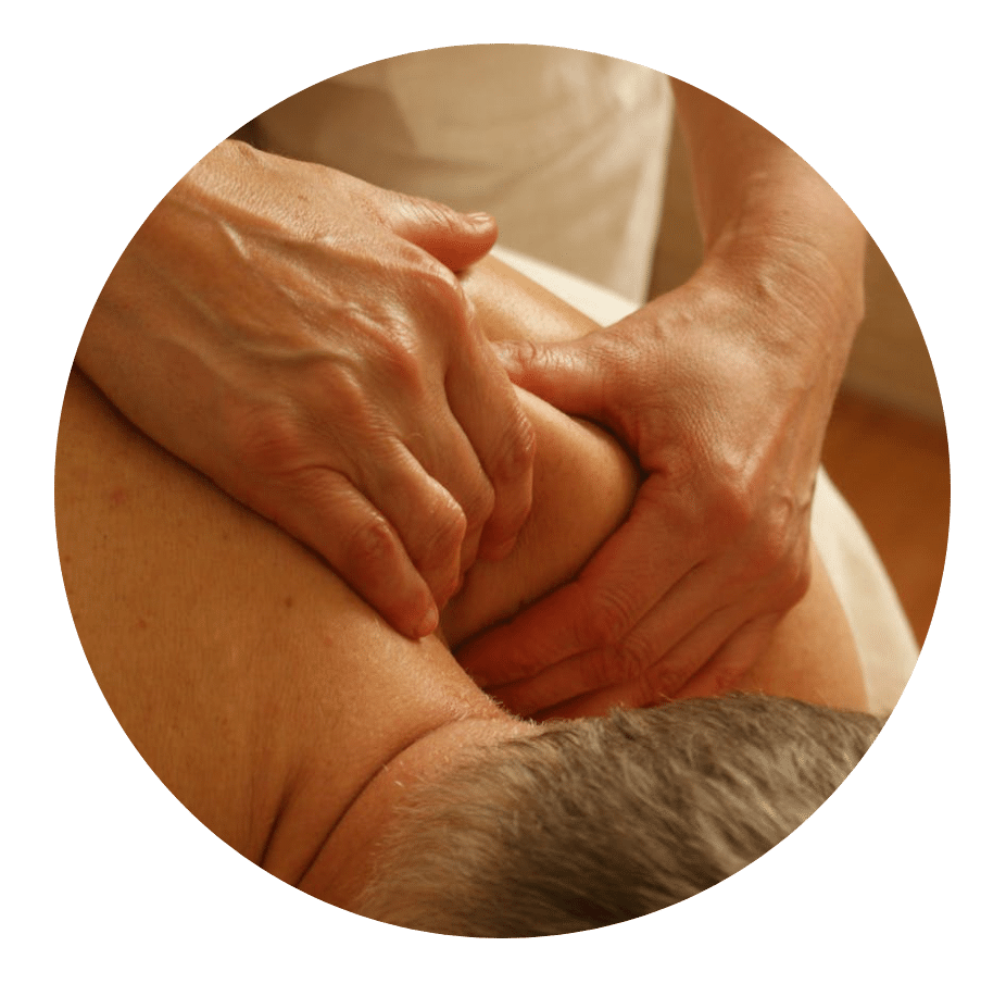 Hands working the muscles of a patient's shoulder and upper back