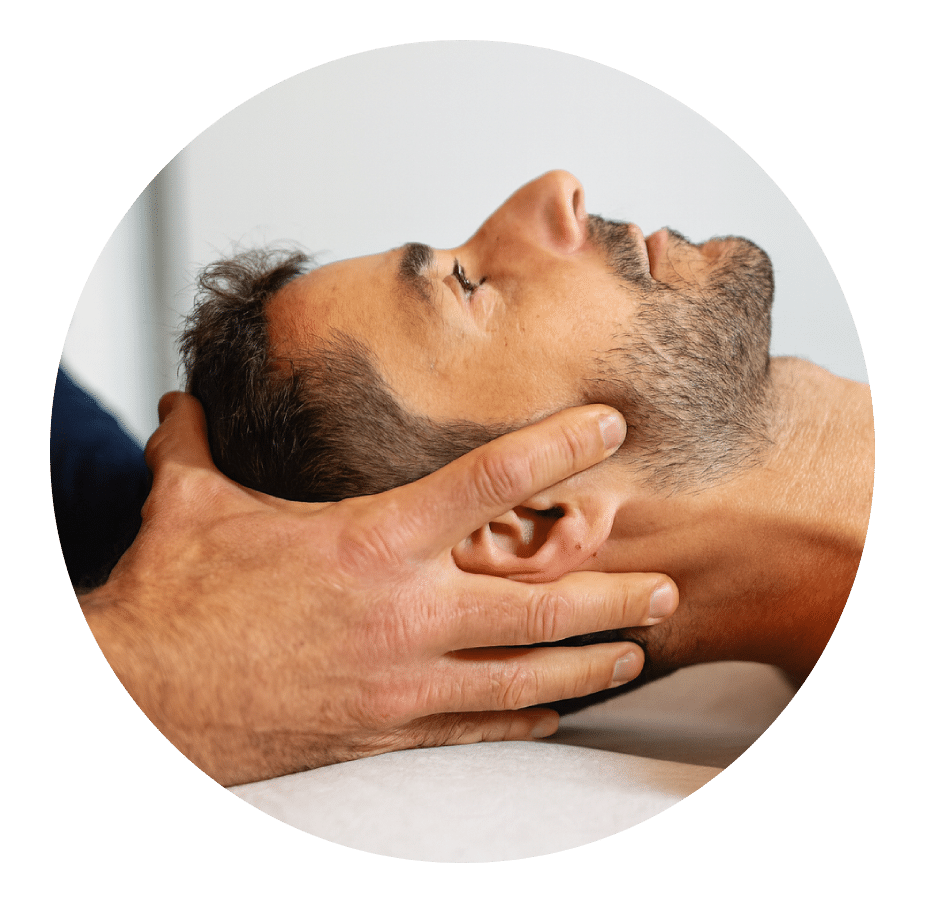 Physical therapist supporting a patient's head to treat neck pain and stiffness