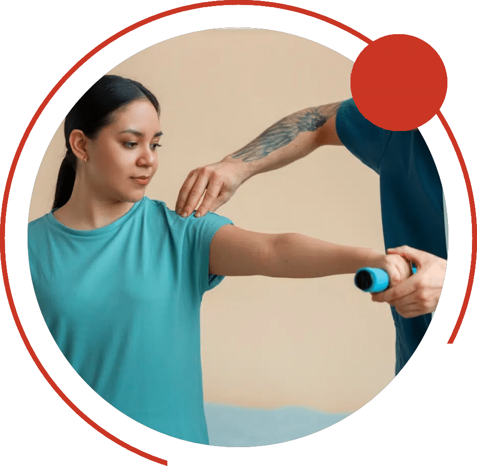 Physical therapist steadying a woman's shoulder as she lifts a small dumbbell